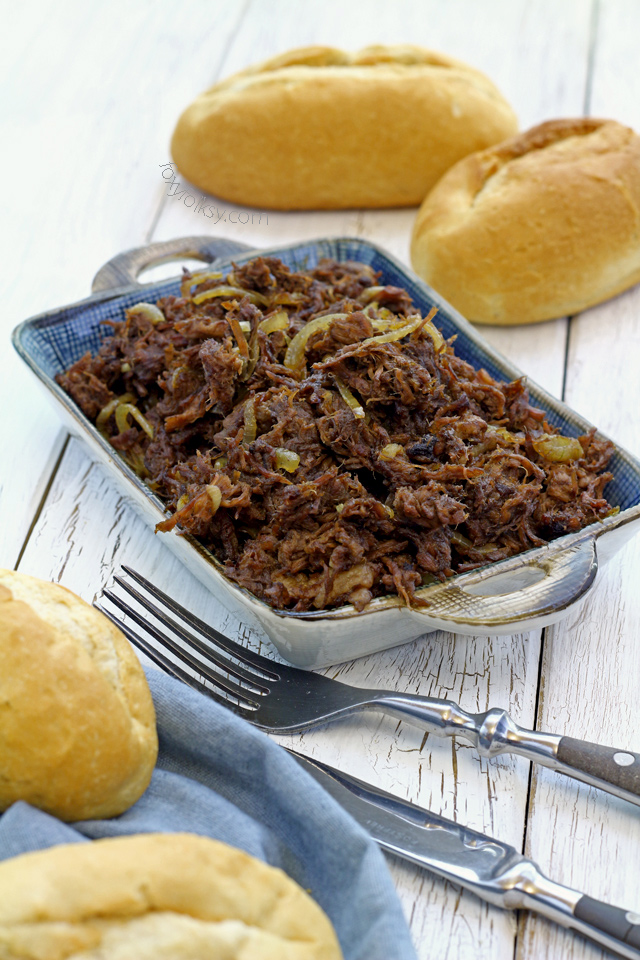 Try this simple pulled beef Asado recipe that is literally slow cooked until so tender without using any fancy slow cooker. | www.foxyfolksy.com