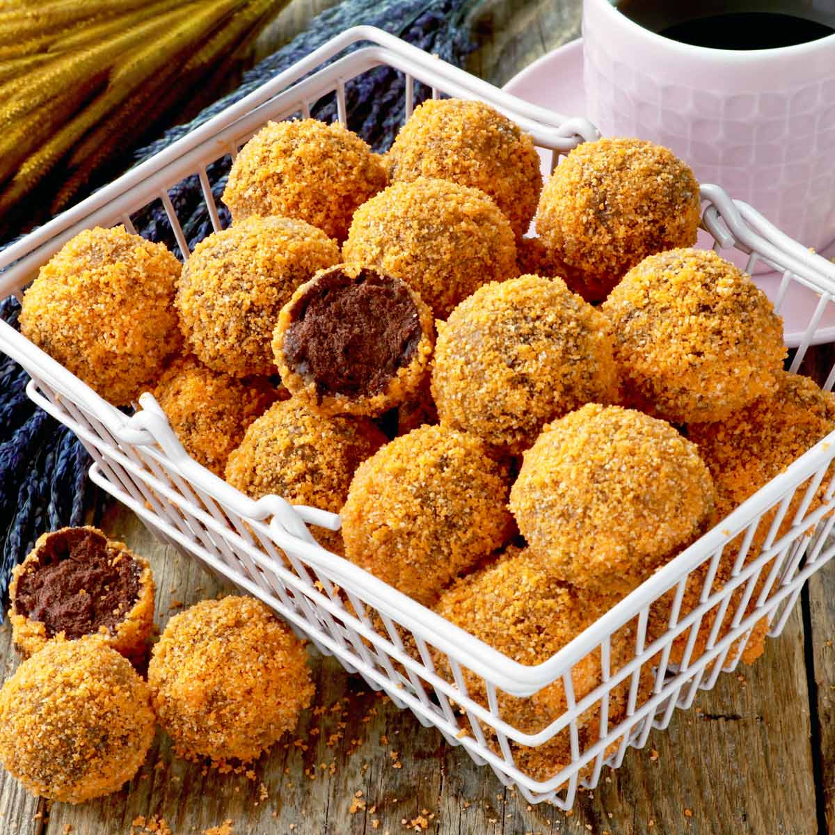 Chocobutternut munchkins or donut holes coverend in nutty orange coating.