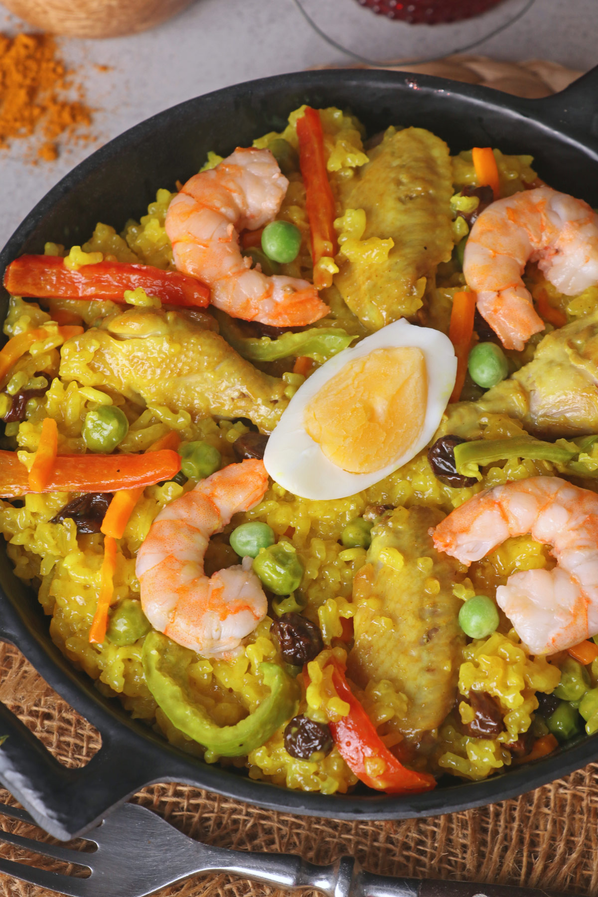 Arroz Valenciana or Bringhe is a flavorful all-in-one Filipino dish from glutinous rice cooked in coconut milk and seasoned with Turmeric or yellow ginger. | www.foxyfolksy.com