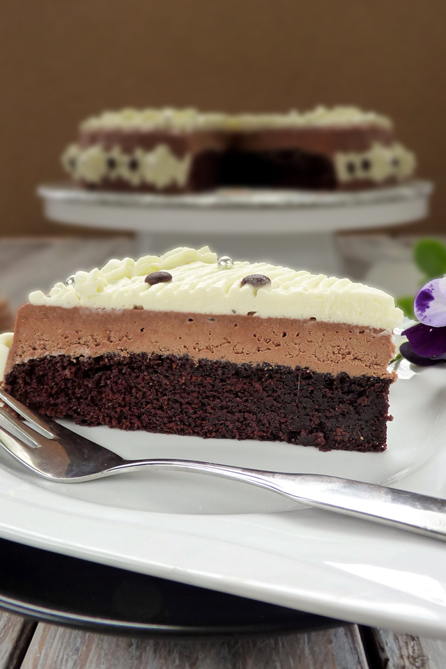 You will surely love this easy Chocolate Mousse Cake Recipe. Moist chocolate cake with a light and creamy chocolate mousse and whipped cream! | www.foxyfolsy.com