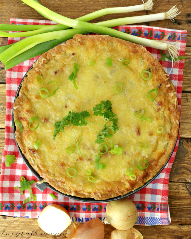 Zwiebelkuchen or onion pie is perfect this fall. Try this savory one-crust pie made of onions, cream, eggs and bacon! An easy one-meal dish! | www.foxyfolksy.com