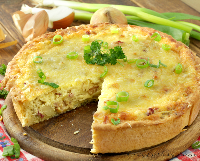 Zwiebelkuchen or onion pie is perfect this fall. Try this savory one-crust pie made of onions, cream, eggs and bacon! An easy one-meal dish! | www.foxyfolksy.com