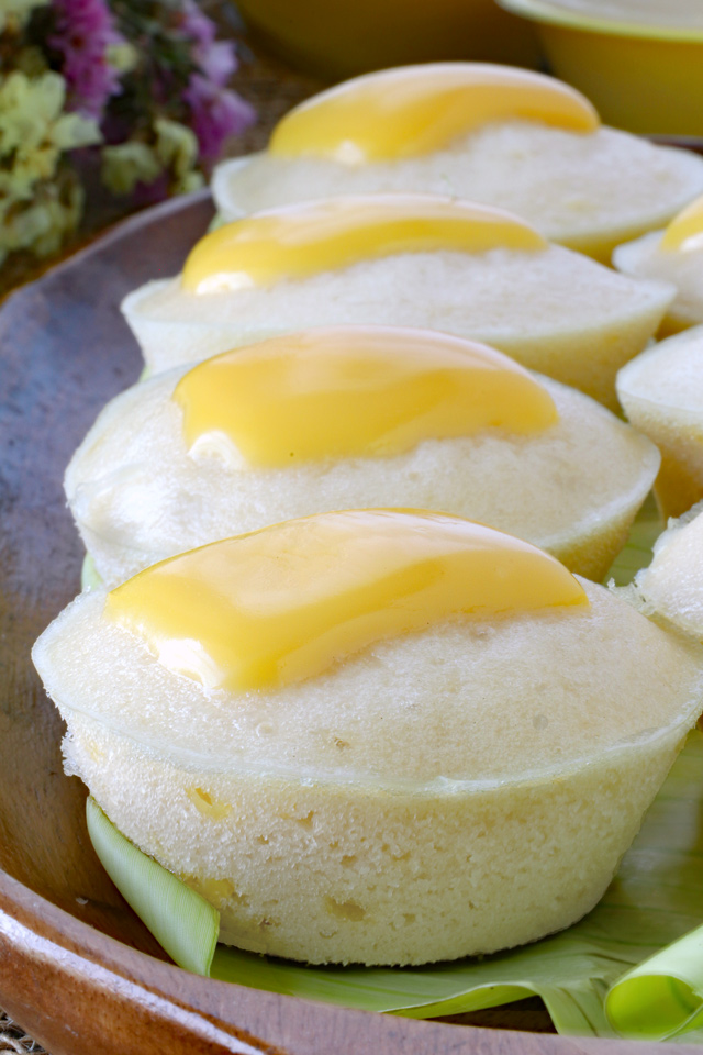Steamed rice cake with cheese on top.