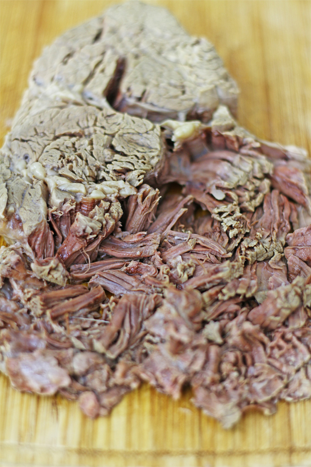 Try this simple pulled beef Asado recipe that is literally slow cooked until so tender without using any fancy slow cooker. | www.foxyfolksy.com