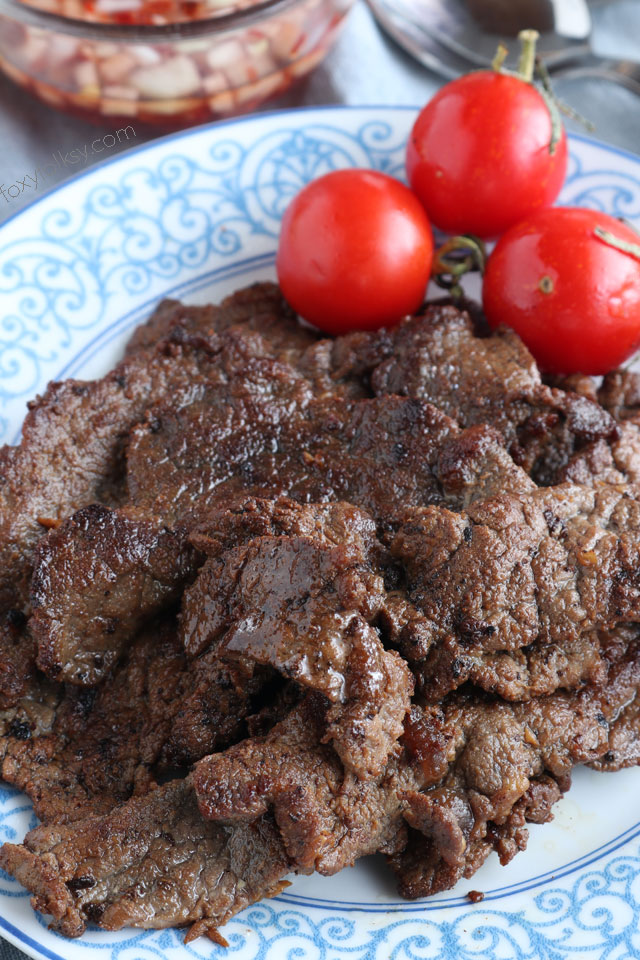 Beef tapa is a type of cured meat of thin slices of tender beef. A popular breakfast that is usually served with a sunny-side up egg and fried rice. | www.foxyfolksy.com