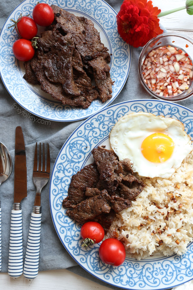 Beef tapa is a type of cured meat of thin slices of tender beef. A popular breakfast that is usually served with a sunny-side up egg and fried rice. | www.foxyfolksy.com