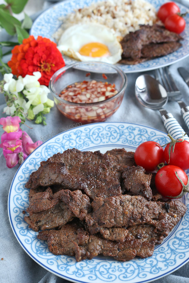 Beef tapa is a type of cured meat of thin slices of tender beef. A popular breakfast that is usually served with a sunny-side up egg and fried rice. | www.foxyfolksy.com