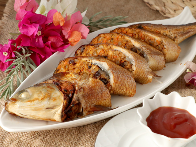 Fried stuffed milfish sliced and served with a dip.