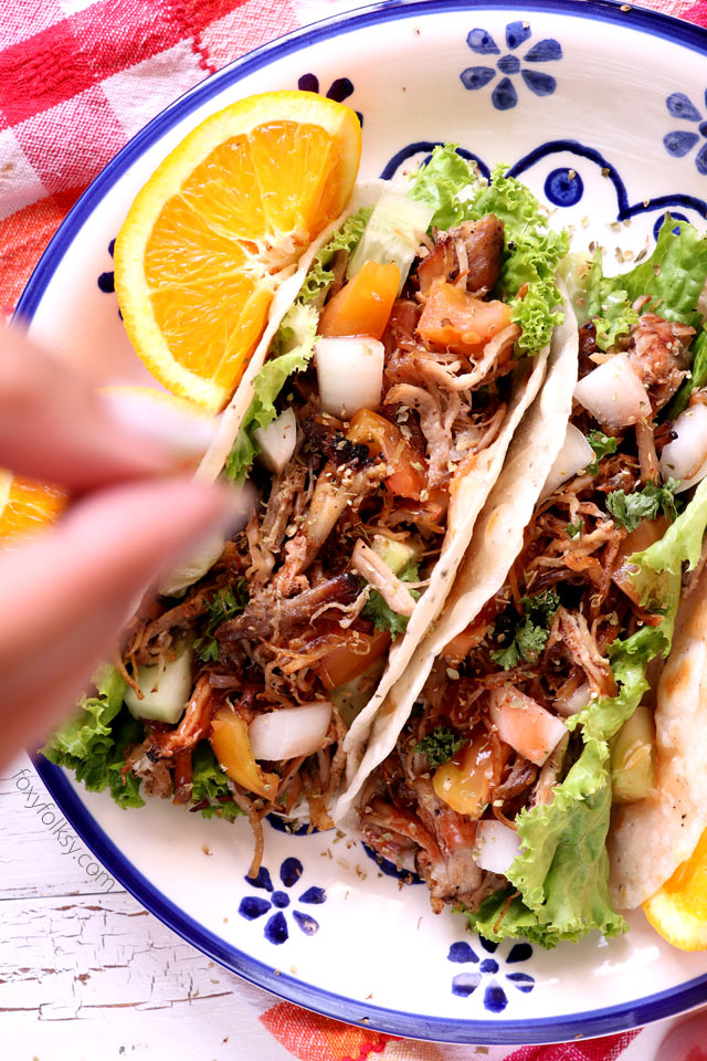 Bring your taco nights to the next level with this Pork Carnitas Tacos recipe. Soft, freshly made tortillas and savory, spicy Pork Carnitas, combined with your favorite taco veggies. Delicious! | www.foxyfolksy.com