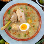 Arroz Caldo or Filipino Chicken Rice Porridge in a bowl.