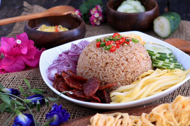 Thai Rice with shrimp paste and sides: green mango, red onions, egg, cucumber and Chinese sausage