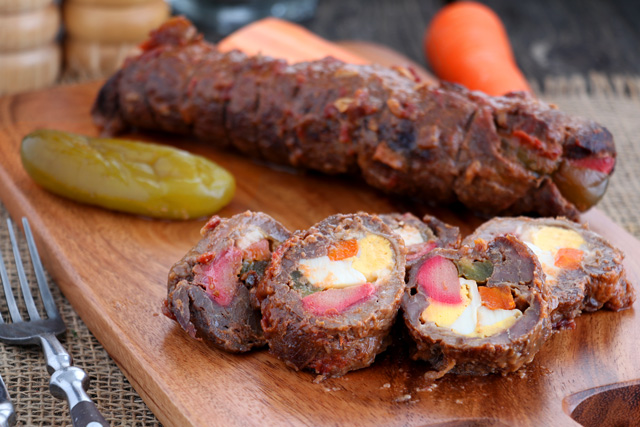 Morcon - beef roll stuffed with hard-boiled egg, pickle, carrots and cheese 