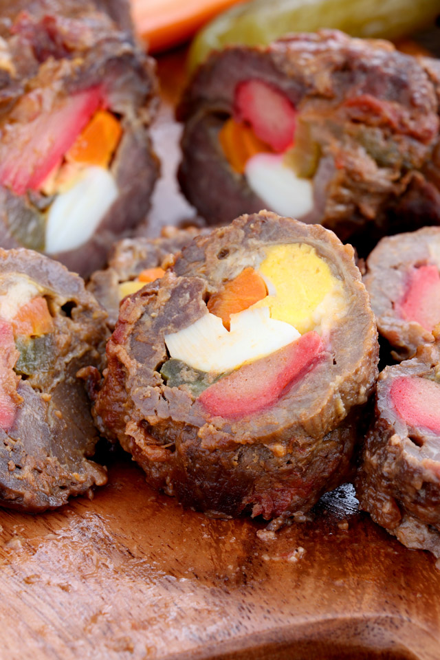 Beef roll stuffed with hard-boiled egg, pickle, carrots and cheese