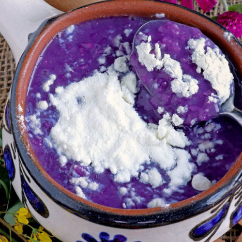 Ube Champorado - Ube-flavored sweet rice porridge with powdered milk