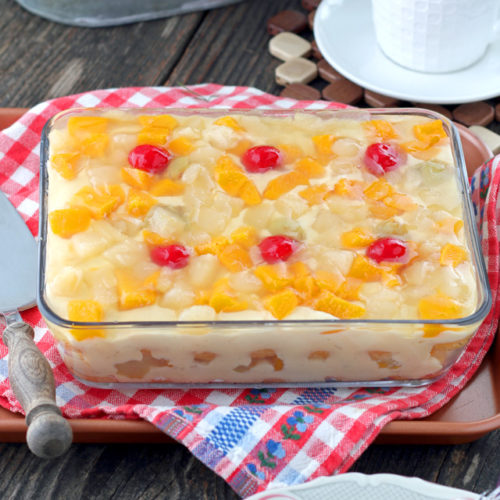 Crema de Fruta- layered dessert of cake, custard, fruit cocktail and gelatin.