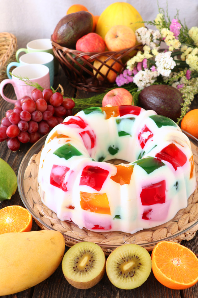 Cathedral Window Dessert with fruits in the background.