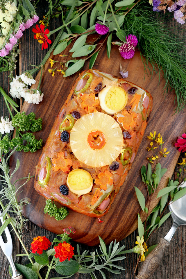 Meatloaf made from pork cubes with pineapple, carrots, raisins, bell pepper.