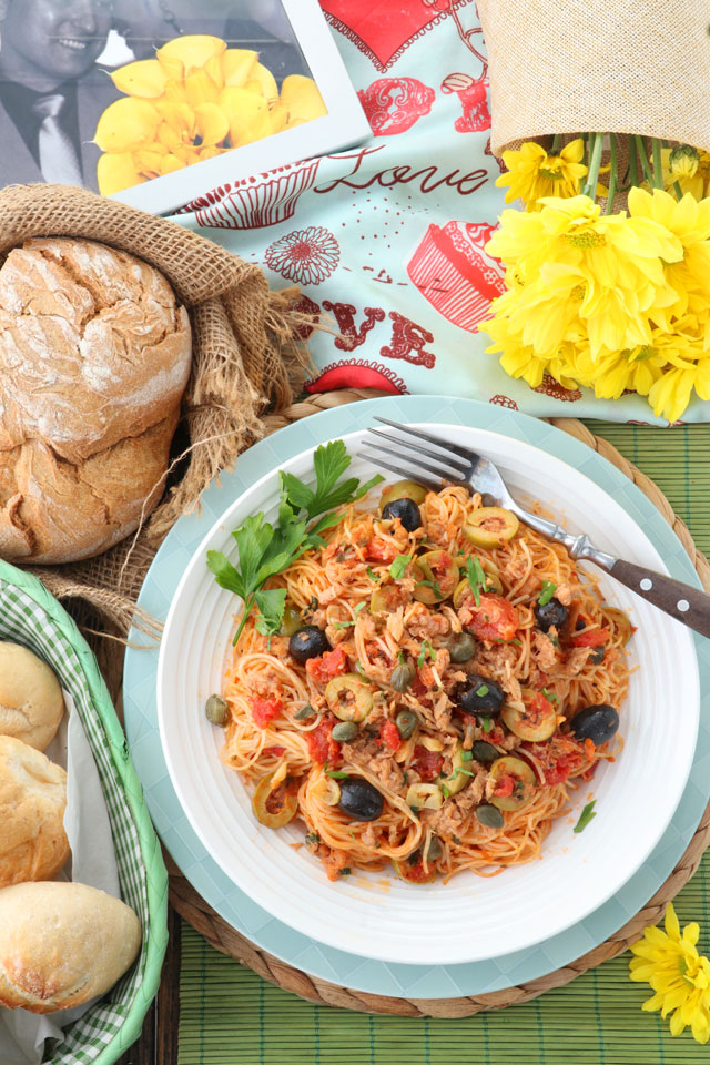 Pasta with tomatoes. olives, capers, garlic and tuna