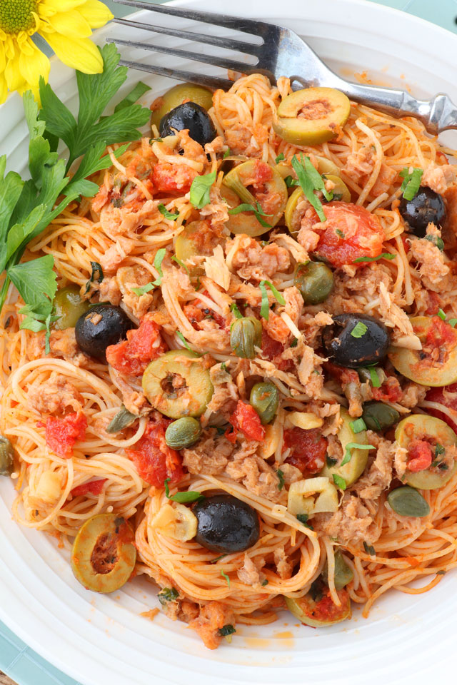 Spicy Italian pasta with tomatoes, olives, capers, garlic.