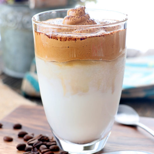 Whipped coffe on top of iced milk