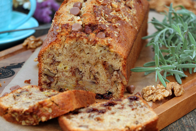 Sliced banana bread with walnuts and chocolate chips.