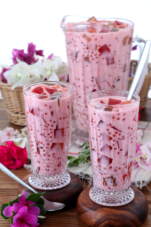 a cold drink with coconut juice, milk and colorful jelly and