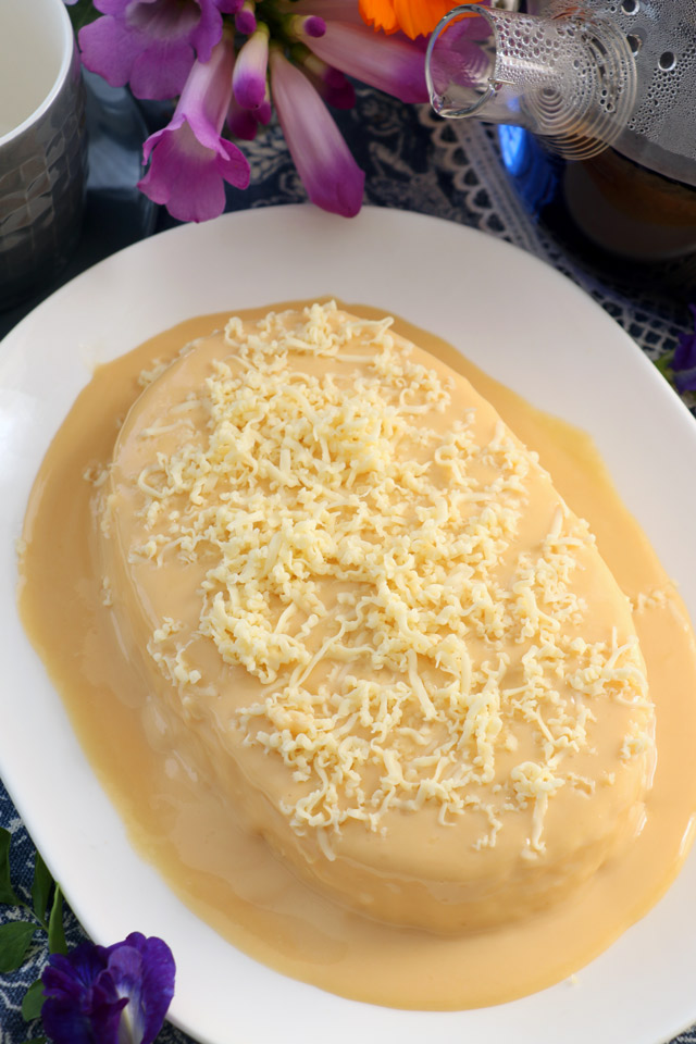 Steamed Yema Cake topped with grated cheese.