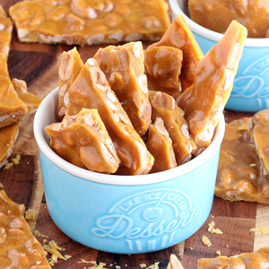 Penut Brittle pieces in a cup