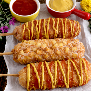 Korean Corn Dogs with ketchup and mustard.