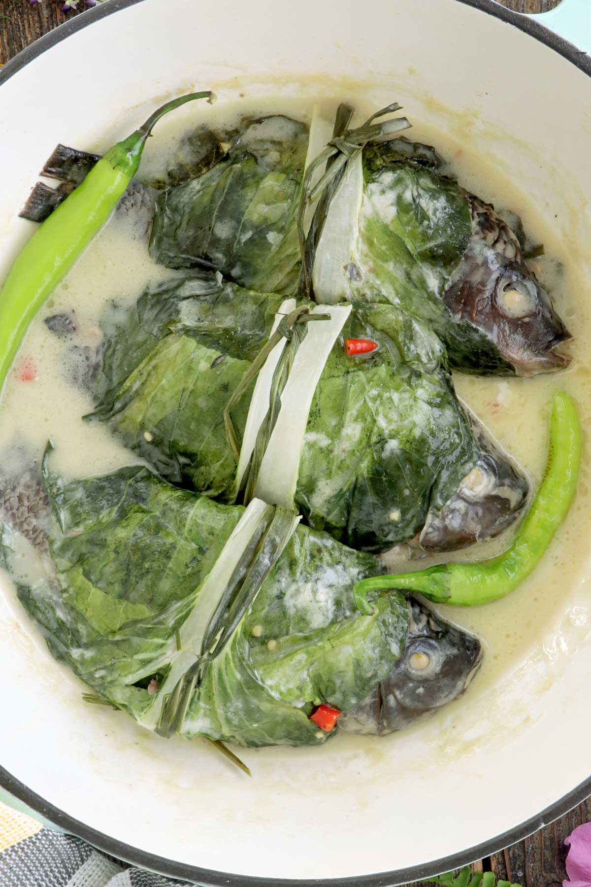 Stuffed fish cooked on coconut milk