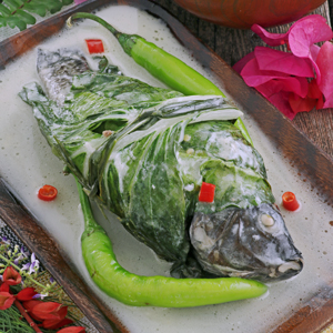 Stuffed Tilapia wraped in bok choy then cooked in coconut milk.