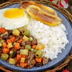 Arroz ala Cubana - a serving of rice, cooked ground meat, fried egg and fried bananas.