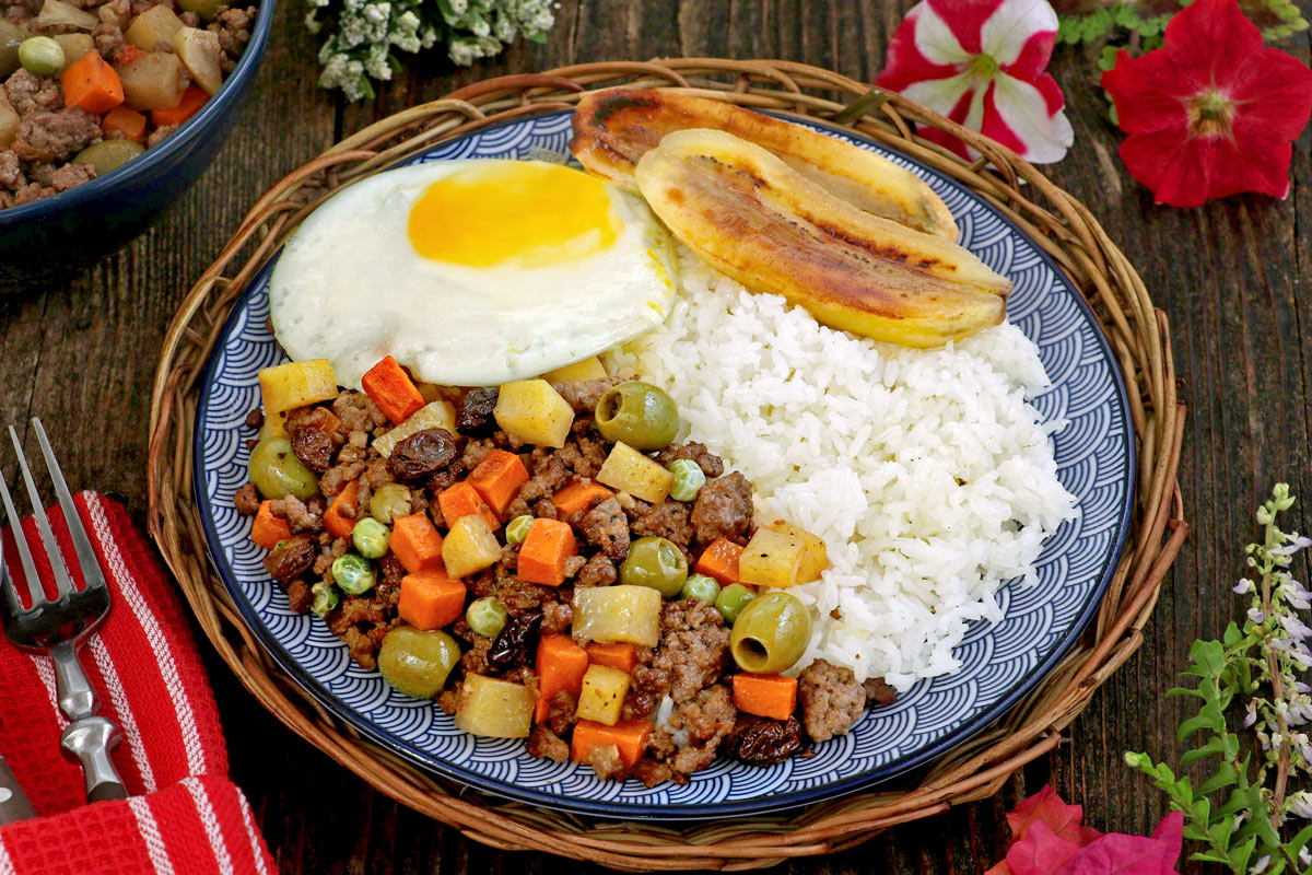 Arroz ala Cubana - a serving of rice, cooked ground meat, fried egg and fried bananas.