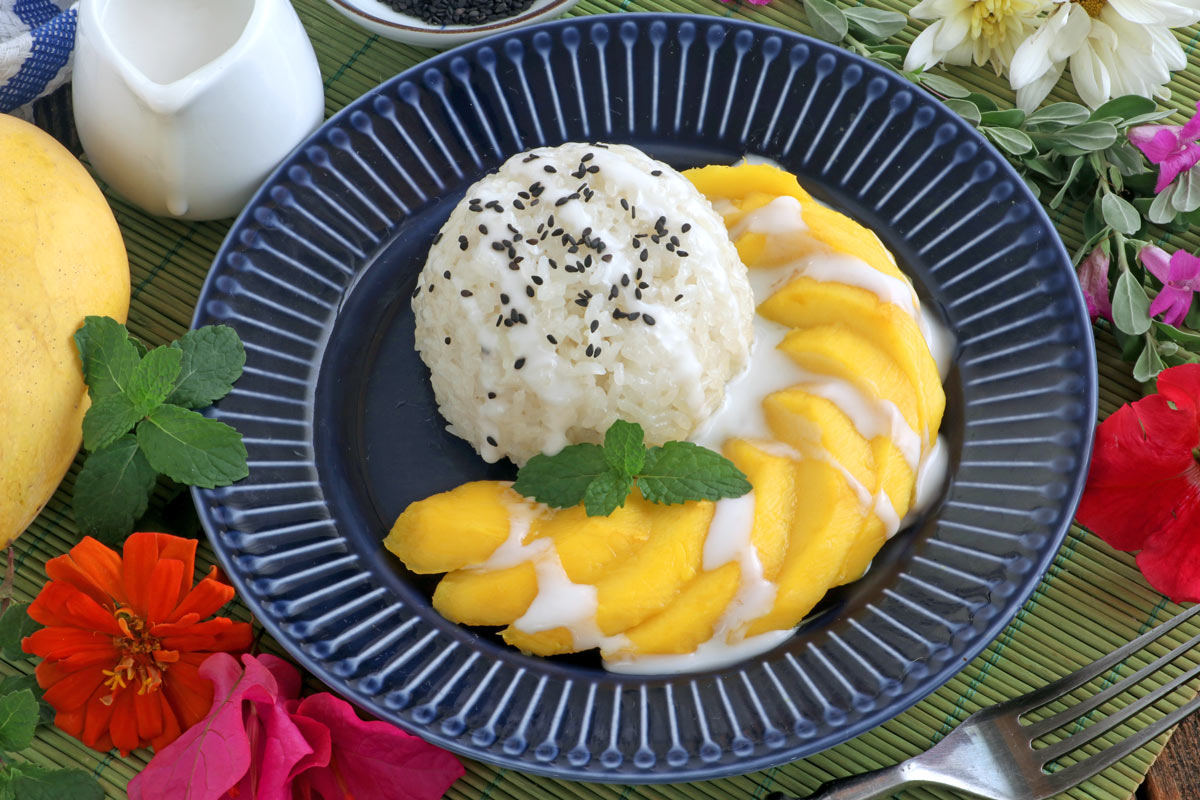 A famous Thai snack or dessert made with ripe mangoes and sticky rice.