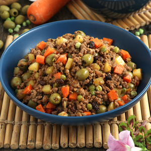 Picadillo recipe complete with ground beef, potatoes, carrots, olives, green peas, and raisins cooked in fresh tomatoes.