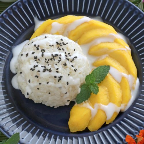 Slices of ripe mangoes served with creamy sticky rice.