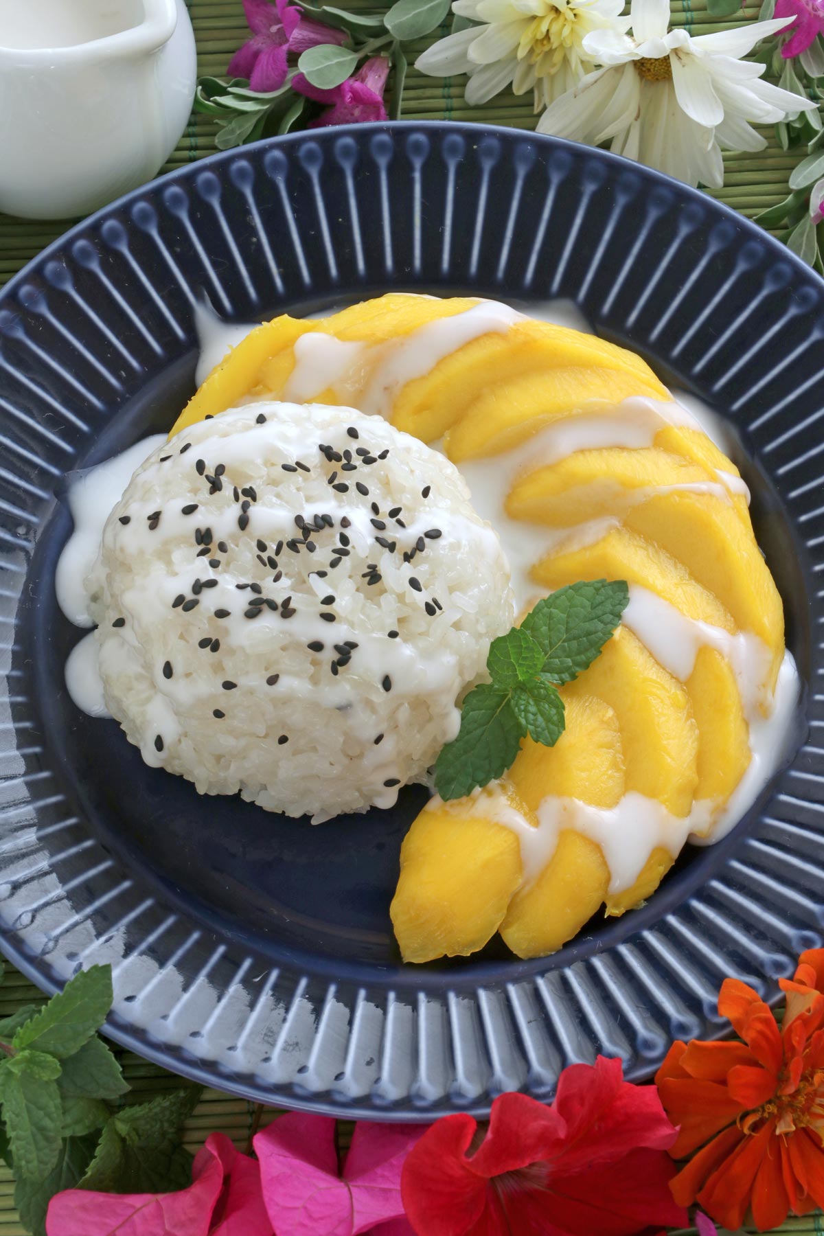 Slices of ripe mangoes served with creamy sticky rice.
