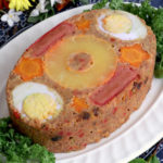 Everlasting - steamed meatloaf in a llanera decorated with pineapple, ggs, hotgods, carrots.