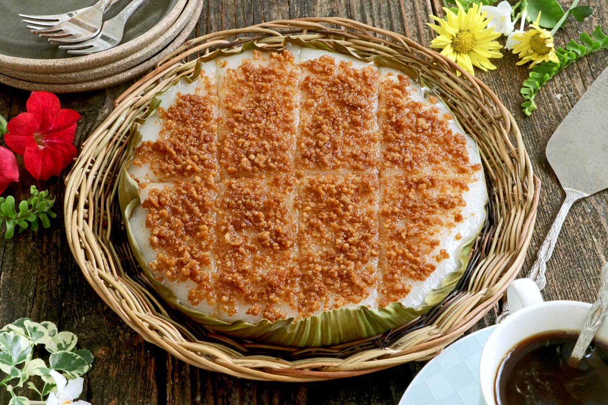 A Filipino steamed sticky rice delicacy with coconut curds.