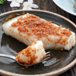 steamed sticky rice cake with coconut curd toppings.