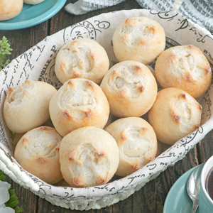 Putok or Star Bread, small dense rolls with cross-shaped fissure on top coated with sugar.