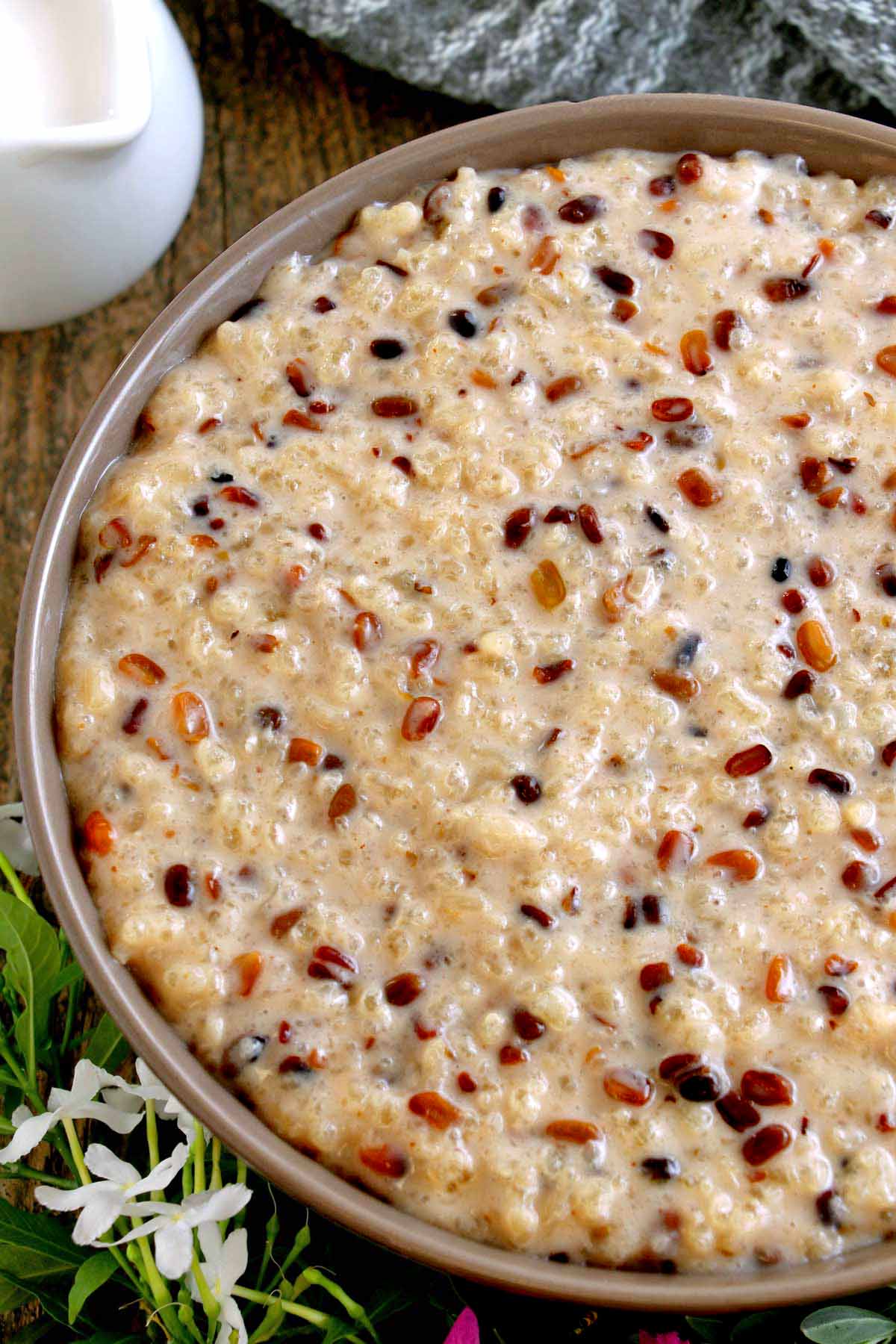 Sticky rice pudding with toasted mung beans in coconut milk.