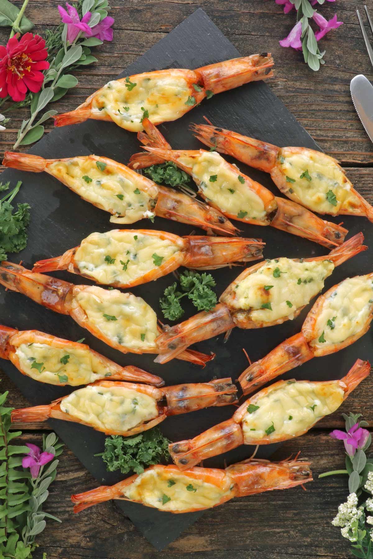 Cheesy baked butterflied shrimp.