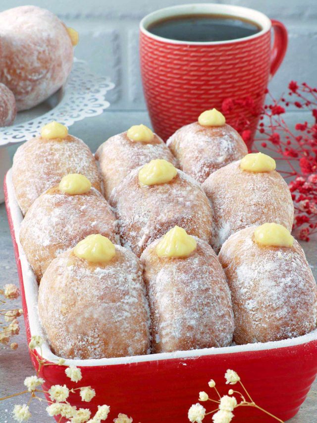 Donuts filled with bavarian cream on a box.