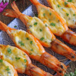 Cheesy butterflied shrimp filled with cheese and baked.