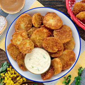 Crispy fried mojo potatoes with dip.