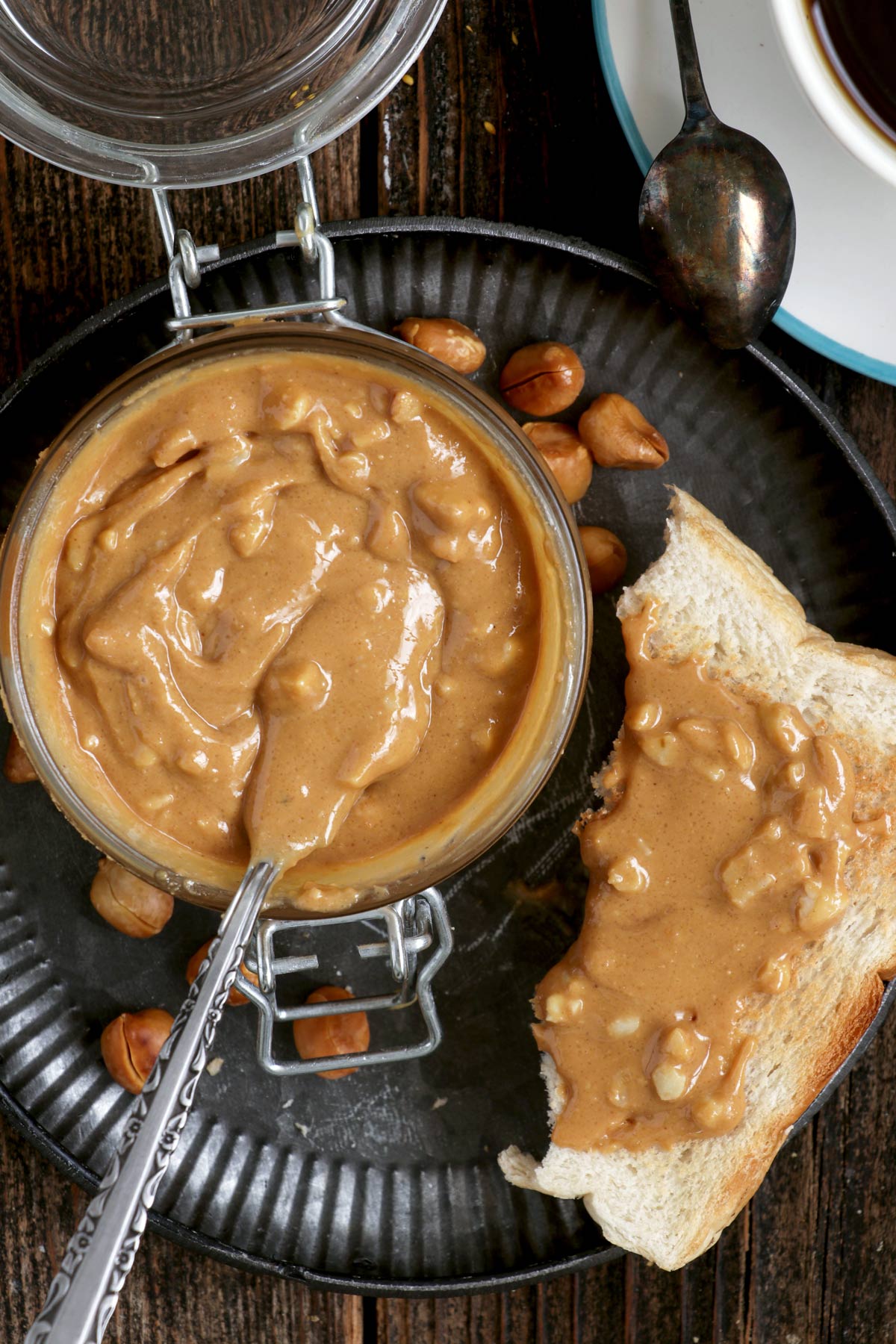 Chunky homemade Peanut Butter in a slice of bread.