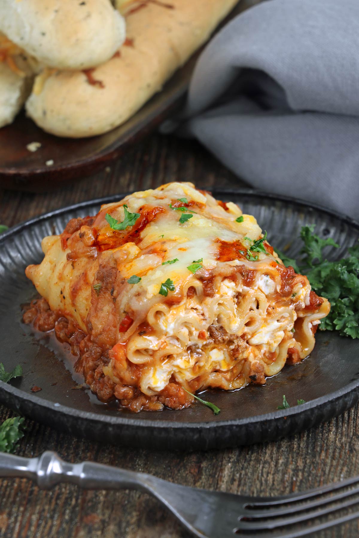 Lasagna with meat sauce and cheese sauce rolled up and baked.