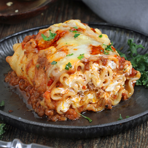 Lasagna with meat sauce and cheese sauce rolled up and baked.