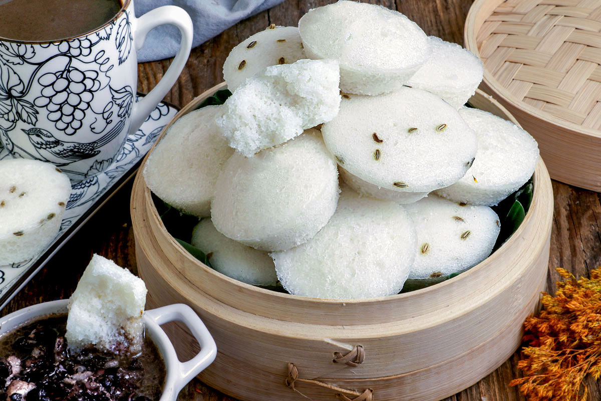 Plain puto and puto with anise cooked in a steamer.